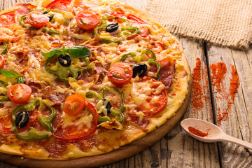 pizza served on wooden table