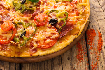 pizza served on wooden table