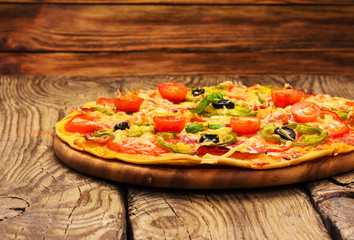 pizza served on wooden table