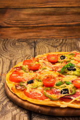 pizza served on wooden table