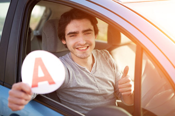 Young man happy to get his driving license