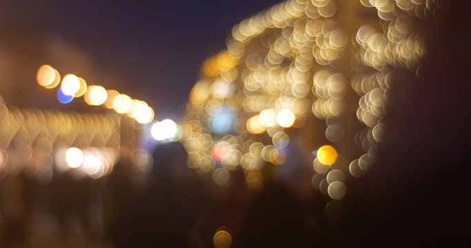 Blurred People Are Walking by Fir-Trees Alley toward Camera Illuminated Clock Tower Lights Shining Garlands at Sofia Square New Year Kiev Ukraine