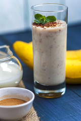Glass of banana smoothie with mint and chocolate
