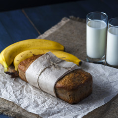 Banana bread, glasses of milk on burlap napkin