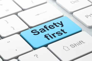 Protection concept: Safety First on computer keyboard background