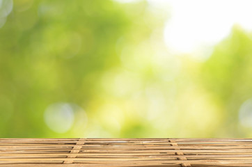 Empty wood table and green bokeh abstract background ,can be used for display your products
