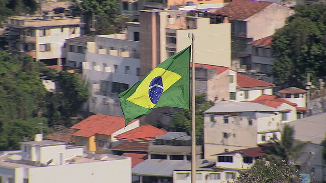Aerial zoom view of Brazilian flag and Copacabana Beach, Rio de Janeiro, Brazil
