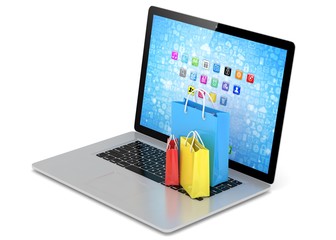 laptop and  shopping pags on white background