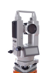 Survey equipment theodolite on a tripod. Isolated on white