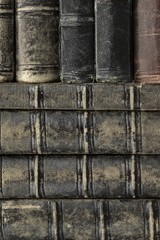 Old Shabby Books With Black Leather Cover Vertical Background
