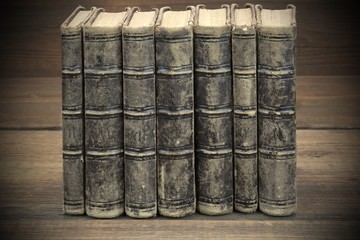 Seven Old Shabby Books With Black Leather Cover Horizontal Backg