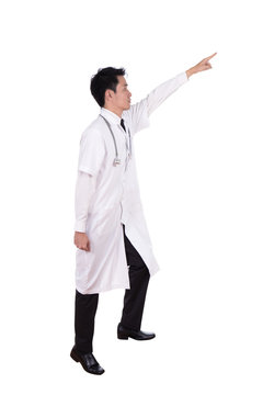 Male Doctor Stepping Up And Pointing To Target Isolated On White