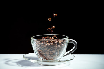 Coffee cup with falling beans