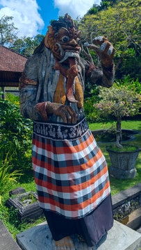 Statue of the god at the entrance to a temple in Bali