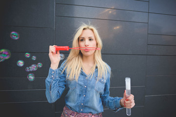 Half length of young handsome blonde caucasian girl having fun p
