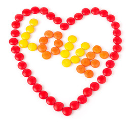 Heart made of red colored sweets round