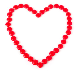 Heart made of red colored sweets round