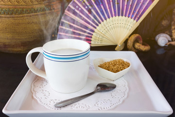 a big white cup of hot black coffee