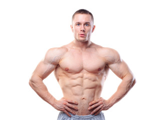 Fototapeta premium Muscular man posing over white isolated background