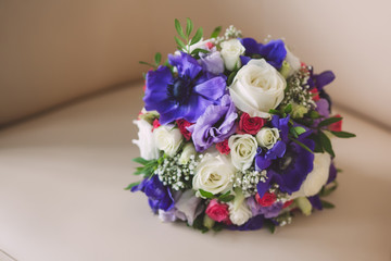 wedding bridal bouquet purple and white colors in the room