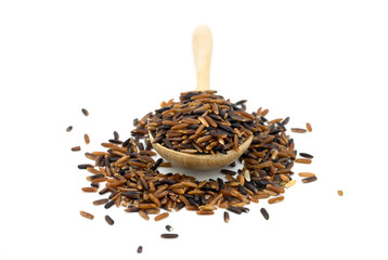 Brown and black rice in a wooden spoon on white background.