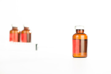 Brown medicine ampule on white