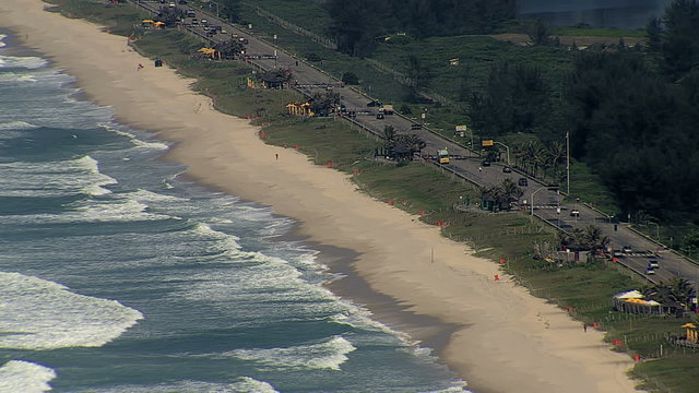 Aerial view of Sandy Beach with Waves and Seaside Road, Brazil