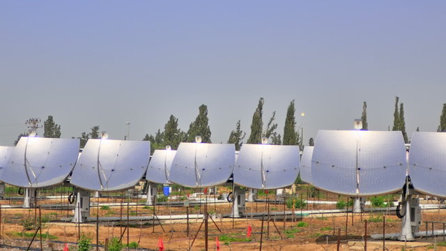 Time-lapse shot of solar collectors tracking the movement of the sun. Cropped.
