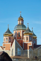 Fototapeta na wymiar Christian church with golden domes and crosses
