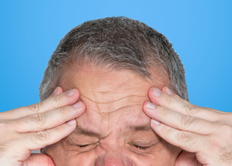 Obraz premium Man with hands on his forehead