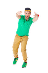 Portrait of young man b-boying in studio isolated on white.