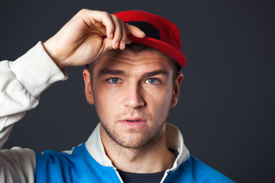 Portrait of cool looking young guy posing in studio.