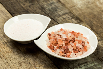 pink himalayan salt over wood background