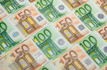Obraz na płótnie Canvas banknotes 50 and 100 euro closeup as background