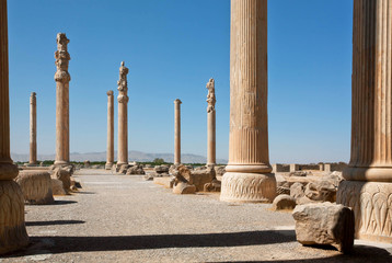 Tall columns in area of ruined city Persepolis, built in 6th century BC. World Heritage Site