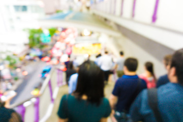 People rush on busy street