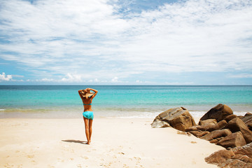 Fototapeta na wymiar Girl on a beach