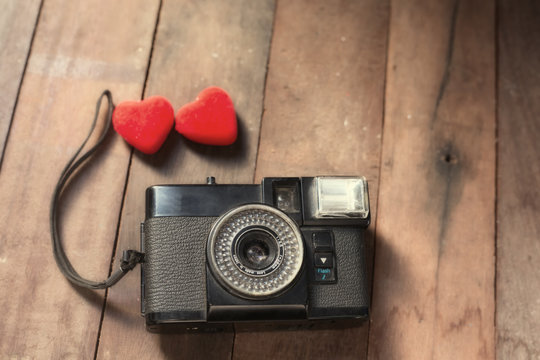 Old retro camera with heart love photography creative concept