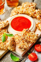 almond crusted chicken tenders with ketchup