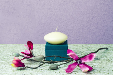 still life candle with flowers