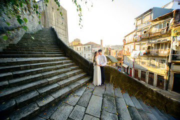 Fototapeta na wymiar beautiful bride and groom on the stairs