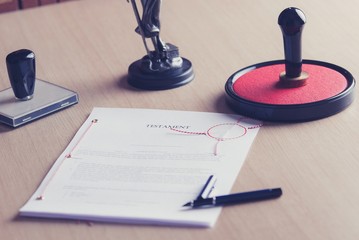 Signed testament on notary public desk