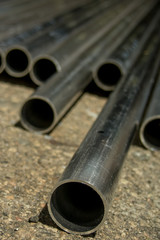 Naklejka premium Stack of Many Pipes at the Construction Site