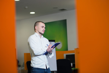 Portrait of young confident men employee dressed in casual cloth