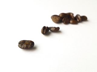 Coffee beans on white background, selected focus