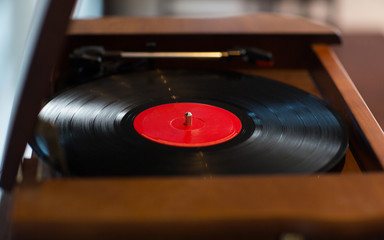 close up of vintage record player with vinyl disc