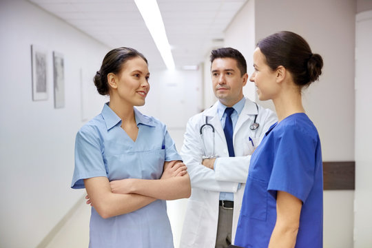 group of medics or doctors talking at hospital