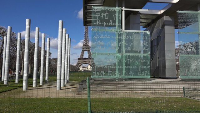 The Wall For Peace monument Eiffel tower zoom in - 60fps. The Wall for Peace is a monument in March 2000 on the Champ de Mars in the 7th arrondissement of Paris.