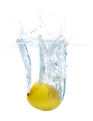 lemon falling or dipping in water with splash