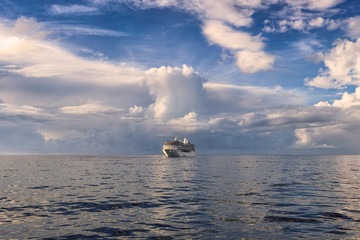 Cruise ship in the ocean near the Bahamas, blue ocean background